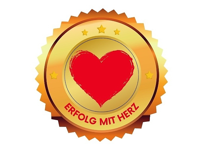 Goldenes Siegel mit einem roten Herz und der Aufschrift Erfolg mit Herz